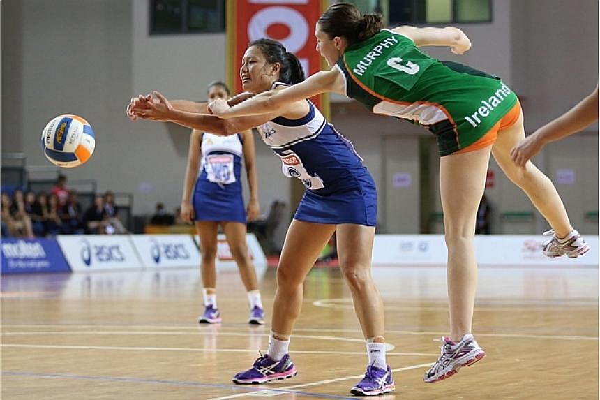 Singapore wins Ireland 47-20 in their third match of the Netball Nations Cup held at the OCBC Arena Hall 1 on Dec 9, 2014. -- ST PHOTO: NEO XIAOBIN