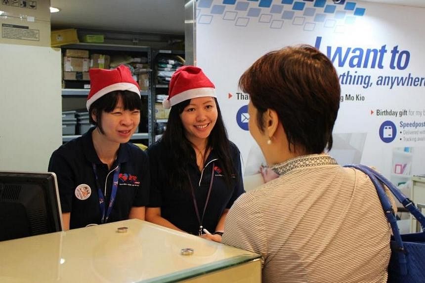 Over 320 of SingPost's management staff will help out at post offices this festive season. -- PHOTO: SINGPOST&nbsp;