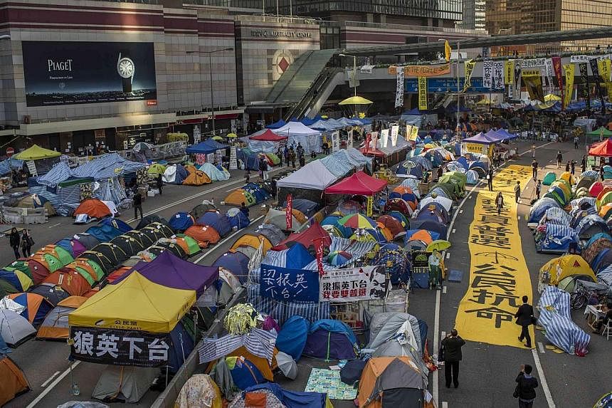 Banners and tents set up by pro-democracy protesters outside the government headquarters at Admiralty, Hong Kong, on Dec 8, 2014. -- PHOTO: REUTERS