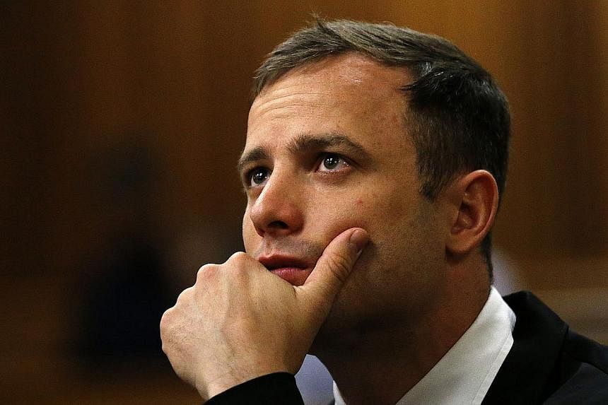 South African paralympic athlete Oscar Pistorius waiting before his sentencing hearing at the North Gauteng High Court in Pretoria on&nbsp;October 16, 2014. -- PHOTO: AFP