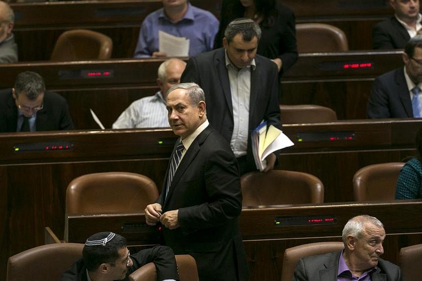 Israel's Prime Minister Benjamin Netanyahu leaves after a vote to dissolve the Israeli parliament, also known as the Knesset, in Jerusalem on Monday. Israel's parliament voted on Monday to dissolve itself in preparation for an early general election 