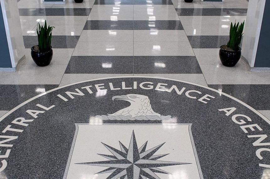 The Central Intelligence Agency (CIA) logo in the lobby of CIA Headquarters in Langley, Virginia. The US Senate will release a long-delayed report today into the CIA's brutal interrogation of Al-Qaeda suspects following the 2001 attacks, as American 