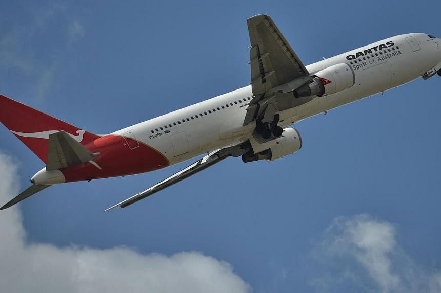 A Qantas plane takes off at Sydney Airport. Three of the airline's planes were forced to make unscheduled landings, including the turnaround of one of the world's longest haul flights. -- PHOTO: AFP&nbsp;