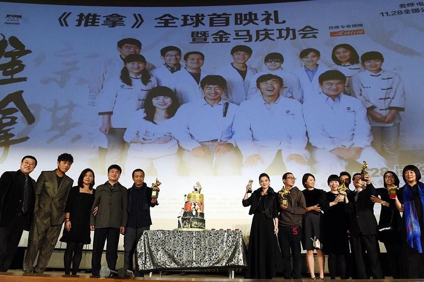 The cast and crew of the award-winning film Blind Massage before its premiere at a cinema in Beijing. The first non-yuan-denominated fund dedicated to investments in China's media entertainment industry, valued at $130 million, was launched yesterday