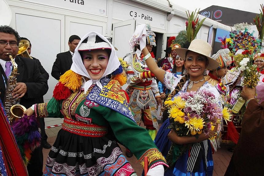 Women dressed in Andean traditional costumes dancing outside the opening of the High-Level Segment of the UN Climate Change Conference COP 20 in Lima, Peru, on Dec 9, 2014. The two-week long United Nations climate summit opened on Dec 1. -- PHOTO: RE
