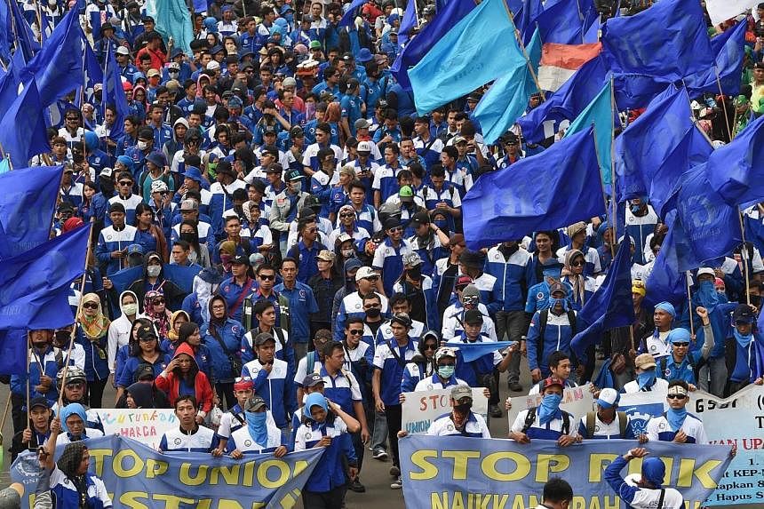 Thousands of workers rallied in the Indonesian capital Jakarta on Dec 10, 2014.. -- PHOTO: AFP