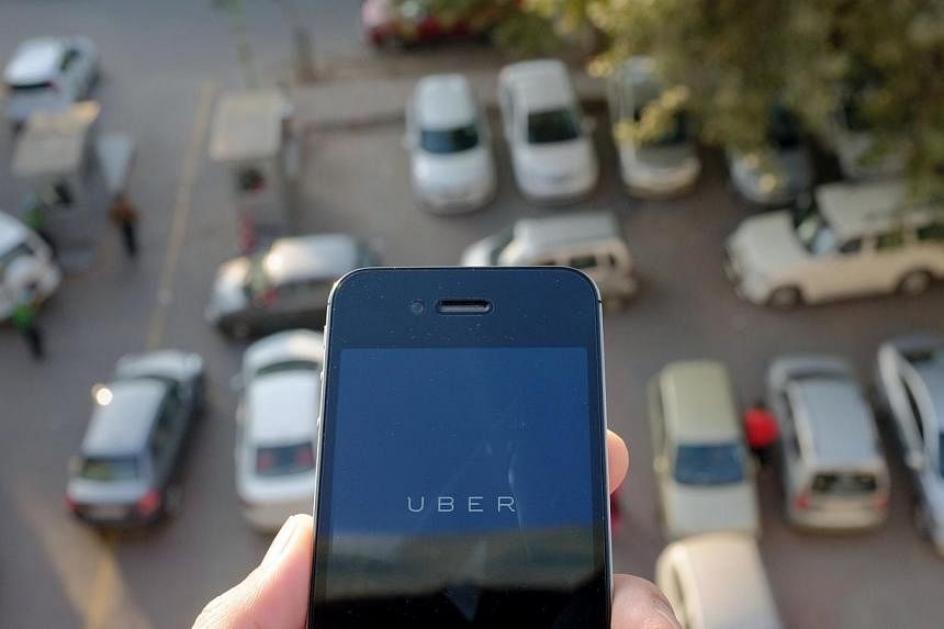 Thailand has partially banned services by ride-sharing application Uber, authorities said Wednesday, as the US-based car hire business continues to grapple with regulators across the world. -- PHOTO: AFP