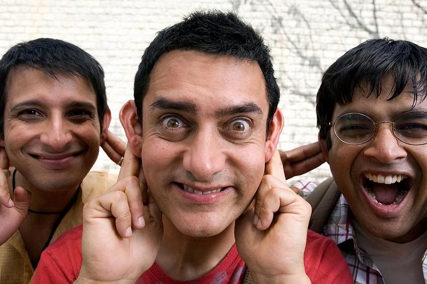 Aamir Khan in the controversial PK poster; in a scene from the film; with his second wife, film-maker Kiran Rao; and in 3 Idiots with Sharman Joshi (above left) and Madhavan (above right). -- PHOTO: JALAN DISTRIBUTORS