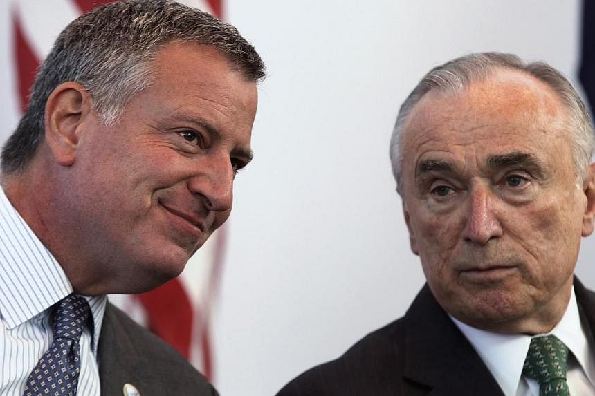New York City police commissioner William Bratton (right) with New York City Mayor Bill de Blasio (left) at&nbsp;a news conference ahead of the city's marathon in New York, Oct 30, 2014. Bratton&nbsp;&nbsp;vowed on Tuesday to repair relations with po