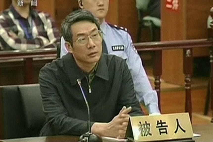Former top economic planning official Liu Tienan during his trial in Langfang, Hebei province on Sept 24, 2014. He was found guilty of bribery on Dec 10 and was sentenced to life in prison. -- PHOTO: REUTERS