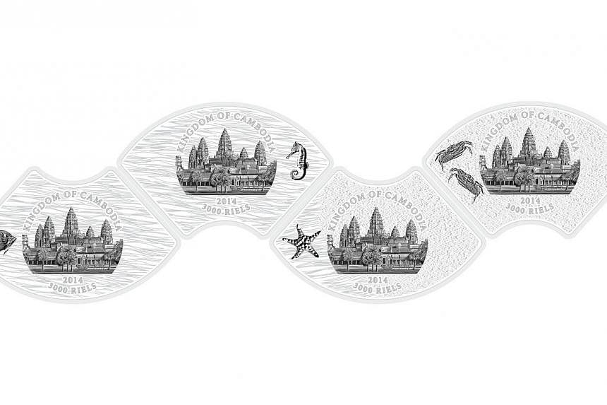 The back of the four marine life-themed coins. When connected, they form the shape of a wave. -- PHOTO:&nbsp;THE SINGAPORE MINT