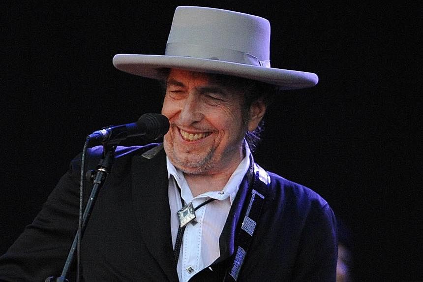 US legend Bob Dylan performs on stage during the 21st edition of the Vieilles Charrues music festival in Carhaix-Plouguer, western France in 2012. Bob Dylan's new album which will come out in February will feature interpretations of classics sung by 