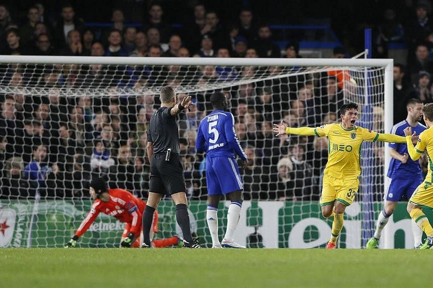 Sporting's Jonathan Silva (third right) celebrates after scoring a goal against Chelsea during their Champions League soccer match at Stamford Bridge in London Dec 10, 2014. -- PHOTO: REUTERS