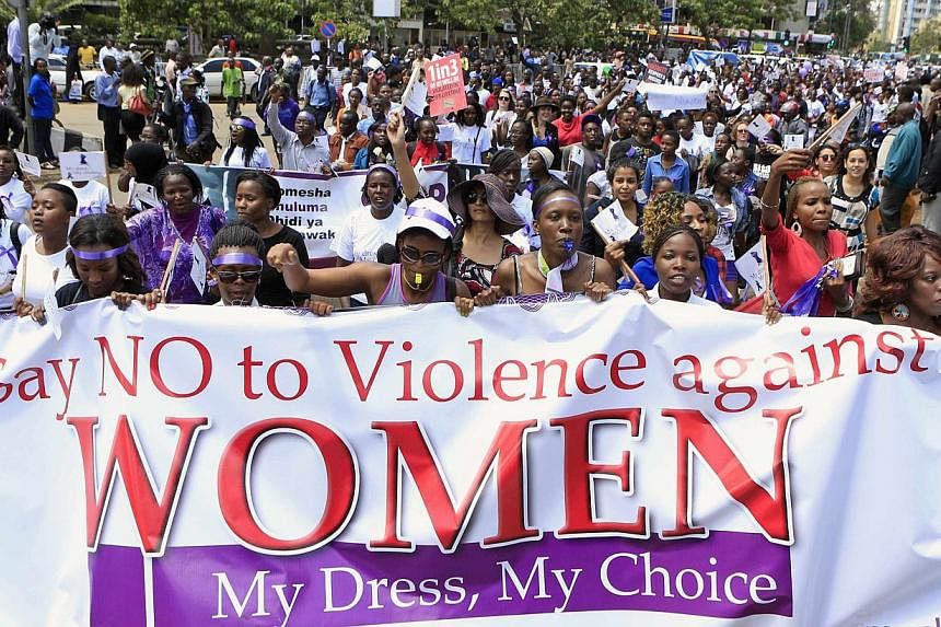 Women take part in a protest along a main street in the Kenyan capital of Nairobi on Nov 17, 2014. Two Kenyans accused of stripping a woman at a petrol station on Sept 19, 2014, have been charged with sexual assault, reports said&nbsp;on Thursday, De