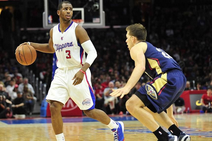 Chris Paul (left) scored 17 points and 15 assists to lead the Los Angeles Clippers to their ninth straight win with a 103-96 victory over the struggling Indiana Pacers Wednesday. -- PHOTO: GARY A VASQUEZ-USA TODAY SPORTS&nbsp;