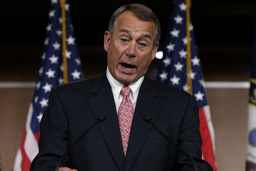 US Speaker of the House John Boehner during a press conference at the US Capitol on Dec 11, 2014 in Washington, DC. -- PHOTO: AFP