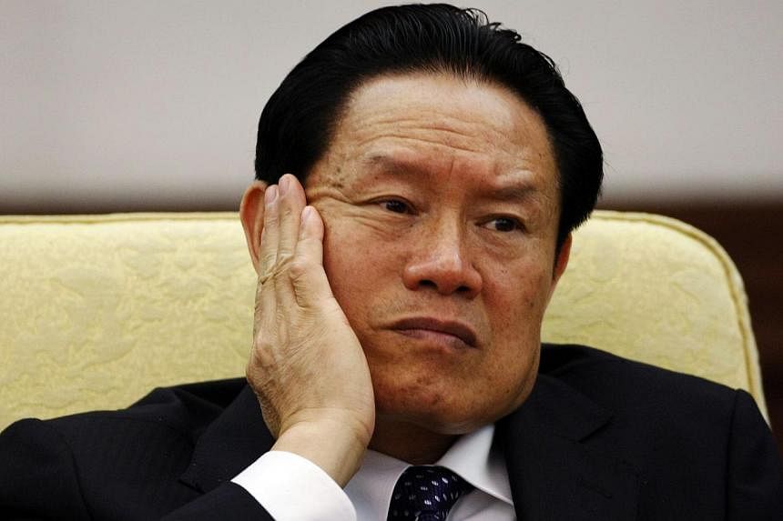 China's former Public Security Minister Zhou Yongkang reacts as he attends the Hebei delegation discussion sessions at the 17th National Congress of the Communist Party of China at the Great Hall of the People, in Beijing in this Oct 16, 2007, file p