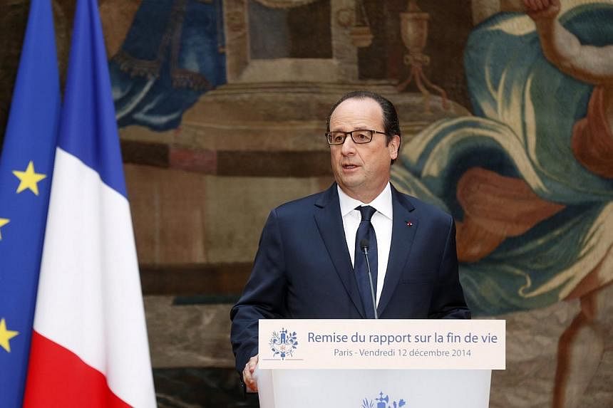 French President Francois Hollande delivers his speech about reform of end-of-life treatment at the Elysee Palace in Paris on Dec 12, 2014.&nbsp;French lawmakers unveiled proposals Friday for a bill that would allow doctors to plunge terminally-ill p