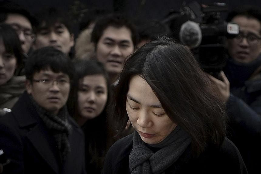 Ms Heather Cho outside the offices of the Aviation and Railway Accident Investigation Board of the Ministry of Land, Infrastructure, Transport, in Seoul on Dec 12, 2014. -- PHOTO: REUTERS