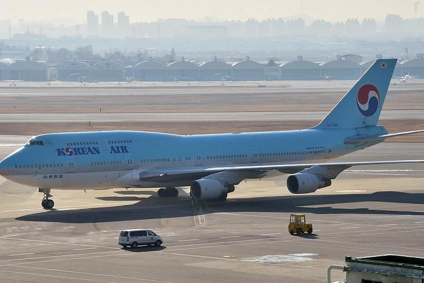 South Korea's Korean Air plane sits on the tarmac at Gimpo airport in Seoul on Dec 9, 2014.&nbsp;-- PHOTO: AFP