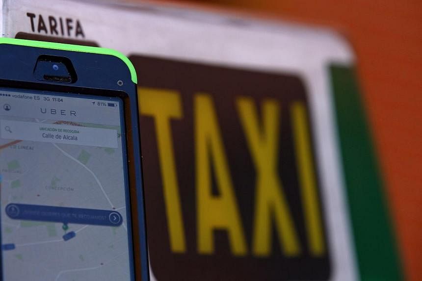 Top Chinese search engine Baidu will make a strategic investment of up to US$600 million (S$750.18 million) in the popular but controversial US taxi app Uber, state media said Friday. -- PHOTO: REUTERS