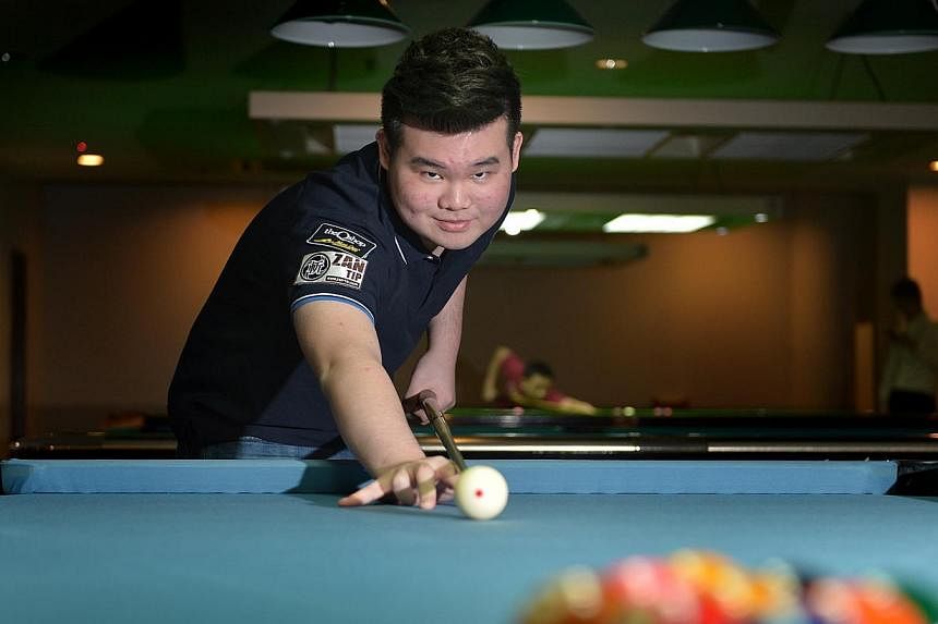 Aloysius Yapp made history last month when he became the first Singapore-born pool player to win a world title. -- PHOTO: ST FILE&nbsp;