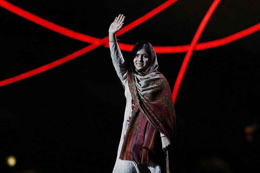 Nobel Peace Prize laureate Malala Yousafzai waves as she arrives on stage at the Nobel Peace Prize Concert in Oslo on Dec 11, 2014. In an exclusive interview with Dawn News, Malala Yousafzai&nbsp;said that she intends to return to Pakistan next year.