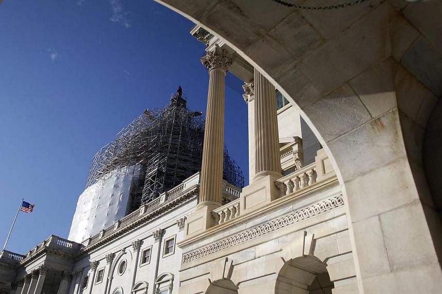 A general view of the US Capitol dome can be seen to the carriage entrance to the US Senate in Washington Dec 11, 2014. With the threat looming of a midnight government shutdown, the fate of a US$1.1 trillion (S$1.4 trillion) US spending Bill was thr