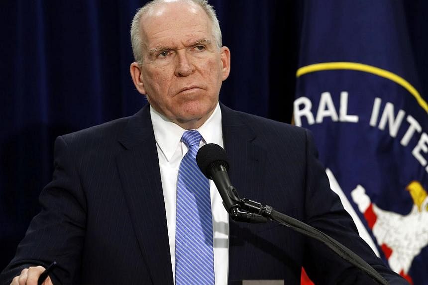 CIA director John Brennan listens to questions from the press during a rare news conference at CIA headquarters in Virginia, Dec 11, 2014. Brennan said on Thursday that some agency officers used "abhorrent" interrogation techniques and said it was "u