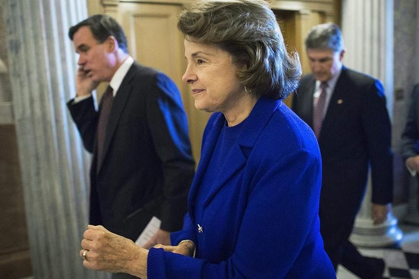 US Senator Dianne Feinstein (centre) at the US Capitol in Washington Dec 11, 2014. As CIA chief John Brennan defended the spy agency's interrogation programme for terror suspects Thursday, Ms Feinstein - whose committee published a damning report on 