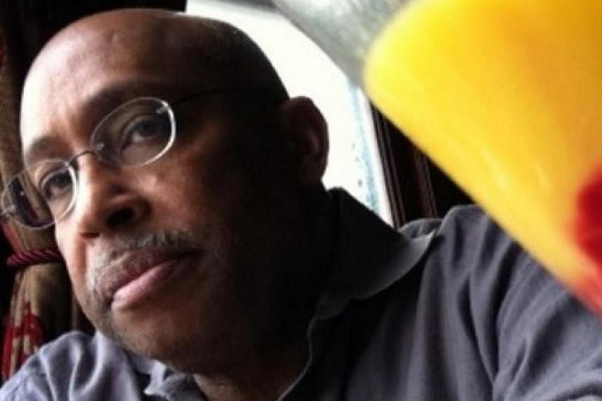 A Washington Post (WP) photographer who won the Pulitzer Prize three times died Thursday of a heart attack while covering the Ebola outbreak in Liberia. -- PHOTO: MICHEL DU CILLE/TWITTER