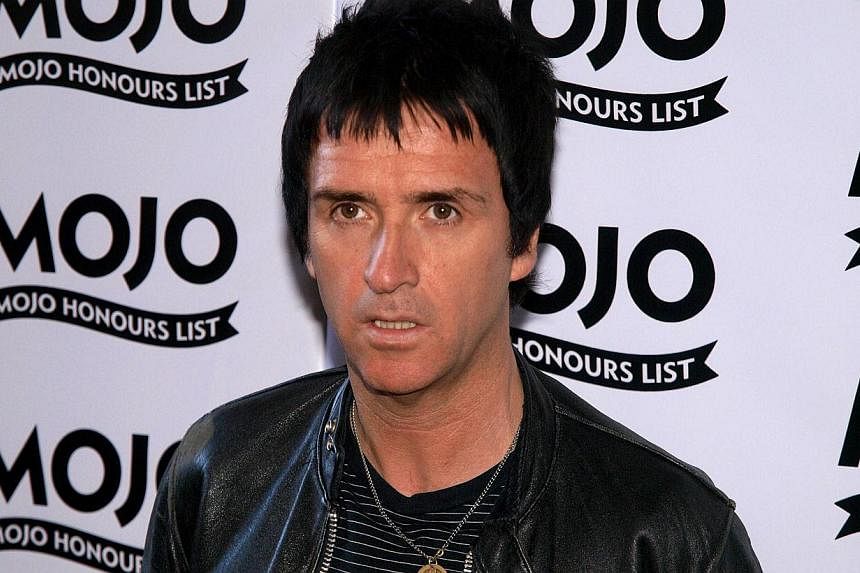 Guitarist Johnny Marr, whose intricate guitar work helped shape rock music from the post-punk era in the 1980s, scrapped a concert on Monday night in Seattle along with nine other West Coast dates. -- PHOTO: AFP