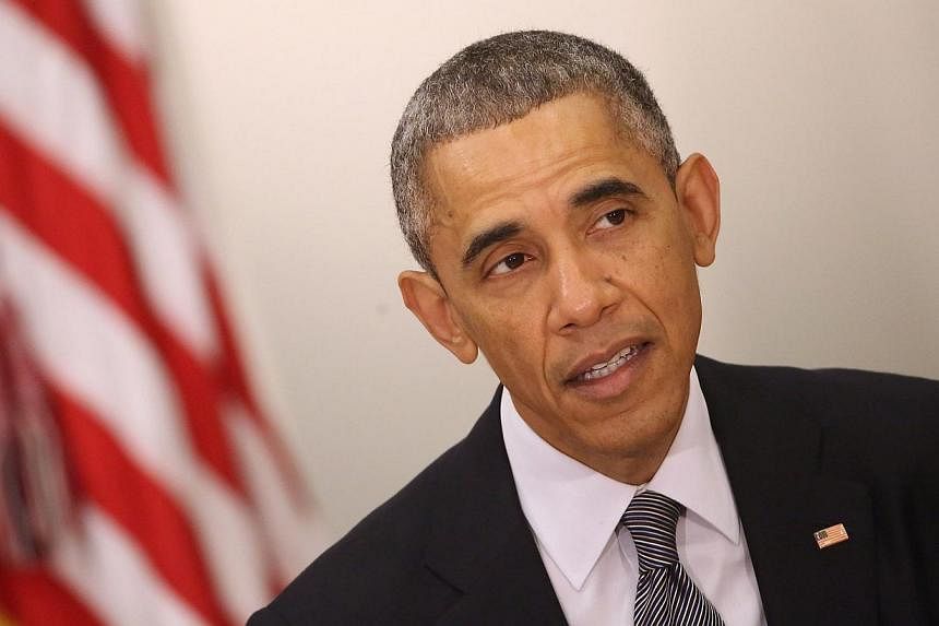 President Barack Obama (above) expressed caution on Thursday about the possibility of the United States adding more sanctions against Russia for its incursion into Ukraine because it could cause divide Washington and Europe. -- PHOTO: AFP