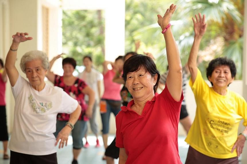 Elderly residents at Thye Hua Kwan Seniors Activity Centre in Bukit Merah practise zumba moves during a session of the Get Movin' for Charity zumba programme. -- PHOTO: KOH SOON SNG FOR GET MOVIN' FOR CHARITY