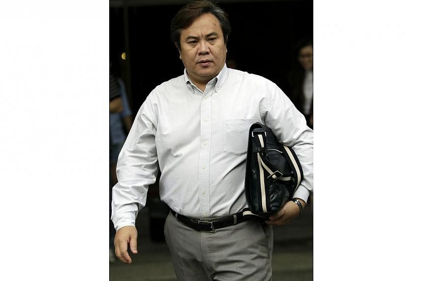 Tan Aik Kim in 2012 when he was first hauled to court for giving bribes totalling $64,500 to several scapegoats to take the rap for operating illegal gaming houses. He committed the offences between 2004 and 2007. -- PHOTO: ST FILE