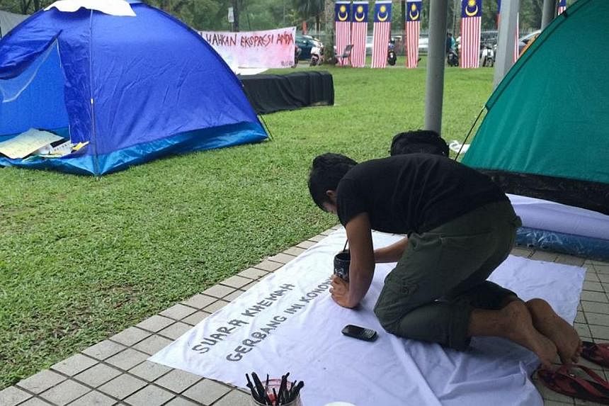 A group of students at Universiti Malaya's (UM) has started their own 'Occupy' camp-in protest against the university's punishment of eight undergraduates for organising an unauthorised talk featuring opposition leader Anwar Ibrahim. -- PHOTO: THE ST
