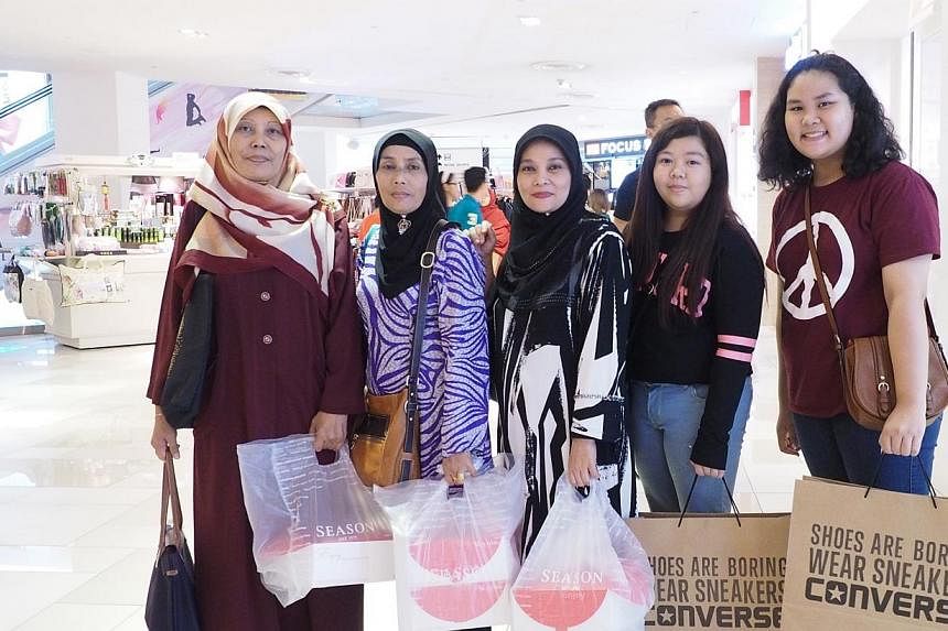 Singapore shopper Rostar Salim (left) and her sisters and nieces at Johor Bahru City Square. -- PHOTO: ERFENDI DHAHLAN