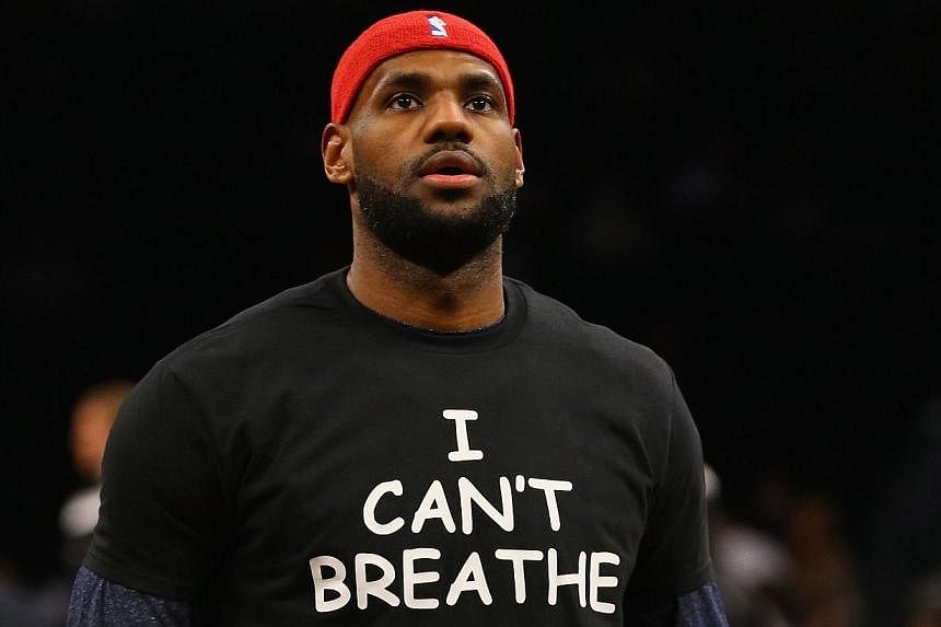 Numerous players in both the NFL and NBA - including LeBron James (above) - have donned T-shirts reading "I can't breathe," the last words spoken by African American father-of-six Eric Garner who died after he was held in a chokehold by a New York po