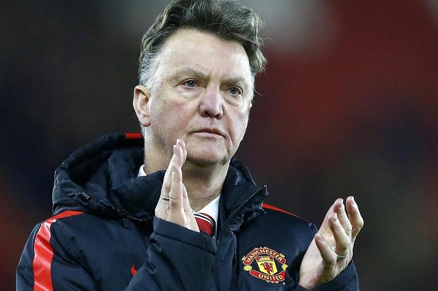 Manchester United record signing Angel Di Maria will miss the visit of bitter rivals Liverpool in the Premier League on Sunday, but the Old Trafford injury crisis is easing, manager Louis van Gaal (above) said on Friday. -- PHOTO: REUTERS