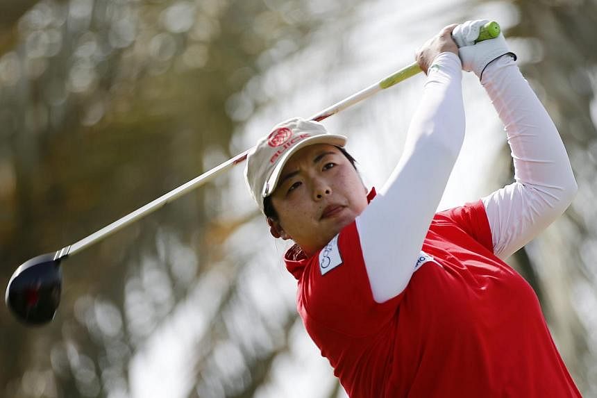 Feng Shanshan of China watches her shot from the 2nd tee during the final round of the Dubai Ladies Masters on Dec 13, 2014. -- PHOTO: REUTERS