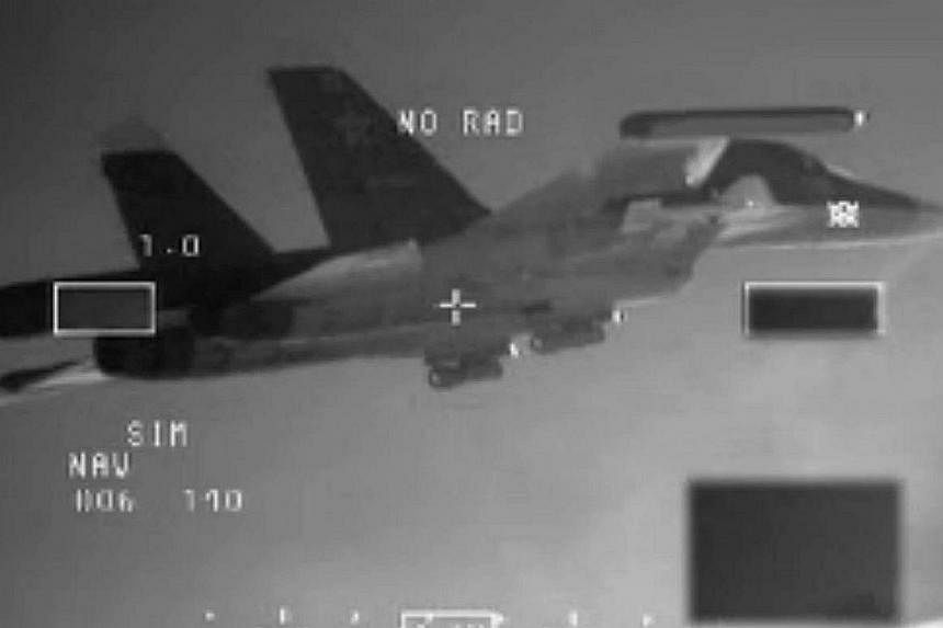 A handout photo released on Dec 11, 2014 by the Dutch Defence ministry shows one of the two Russian SU-34 "Fullback" bombers being intercepted by Dutch F-16's over the Baltic Sea on Dec 8.&nbsp;Russia's defence ministry on Sunday denied a report by S