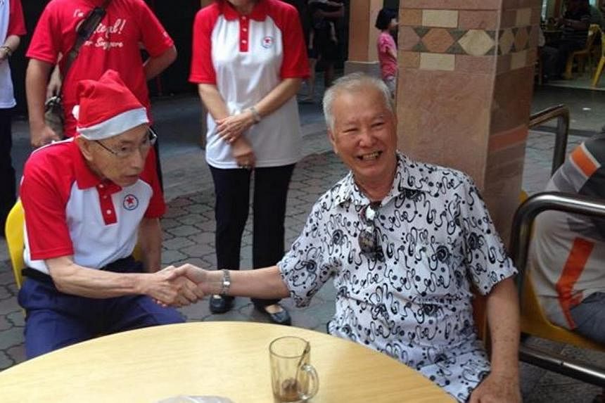 Veteran politician Chiam See Tong greeting residents in Potong Pasir on a "year-end walkabout". -- PHOTO: SINGAPORE PEOPLE'S PARTY/FACEBOOK&nbsp;