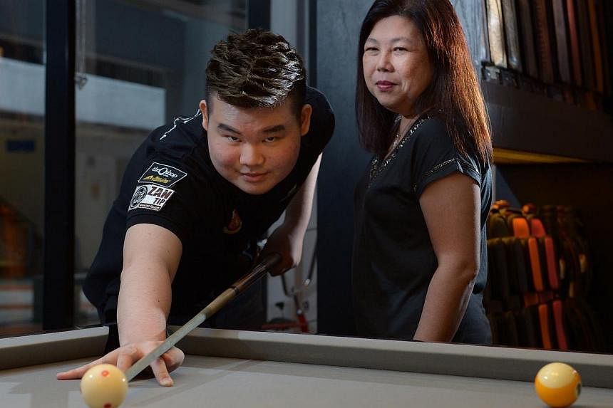 Aloysius Yapp, with his mum Angie Tay, is eyeing a chance to win a gold medal before a home crowd in next year's SEA Games.