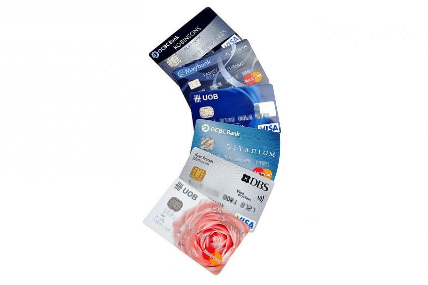 Paying with plastic has become so common that outstanding credit card loans are set to top $10 billion for the first time by Christmas. -- PHOTO: ST FILE&nbsp;