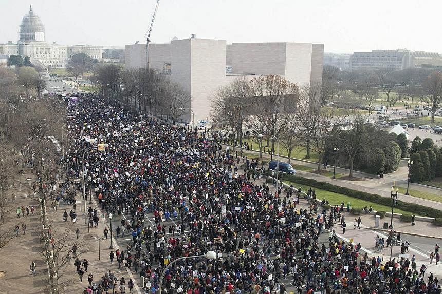 Thousands take part in the Justice for All March and Rally down Pennsylvania Avenue to the US Capitol in Washington, DC, on Dec 13, 2014. Thousands of people descended on Washington to demand justice Saturday for black men who have died at the hands 