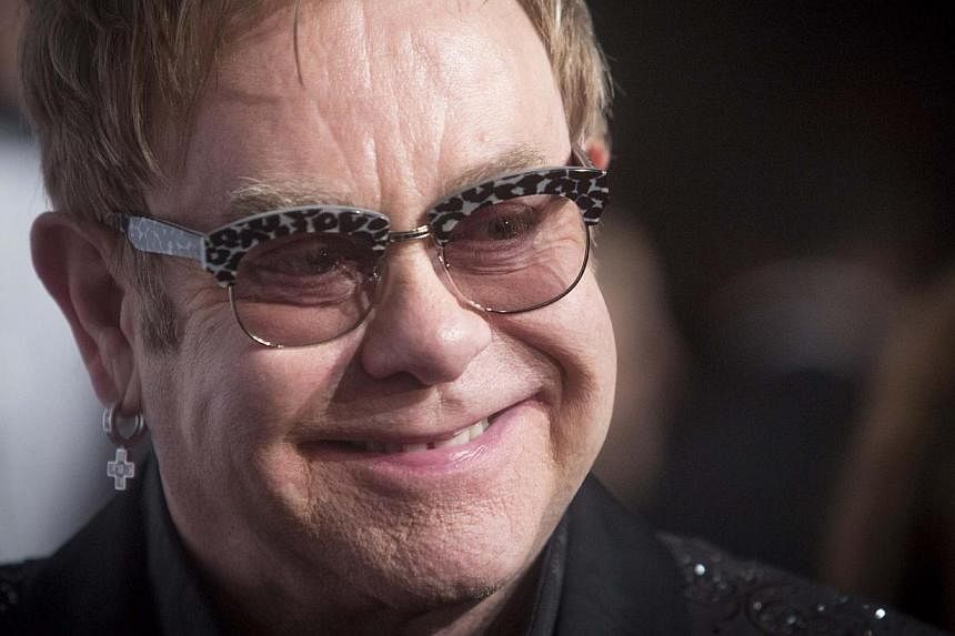Pop music great Elton John (above) opened a new stand named after him at English Championship club Watford's Vicarage Road ground on Saturday, describing it as "one of the greatest days of my life". -- PHOTO: REUTERS