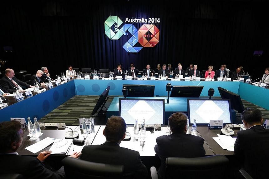 Australia's Prime Minister Tony Abbott (centre-in background) addresses the B20 meeting before the G20 leaders summit in Brisbane on Nov 14, 2014.&nbsp;In November this year, leaders of the Group of Twenty (G20) vowed to implement an anti-corruption 