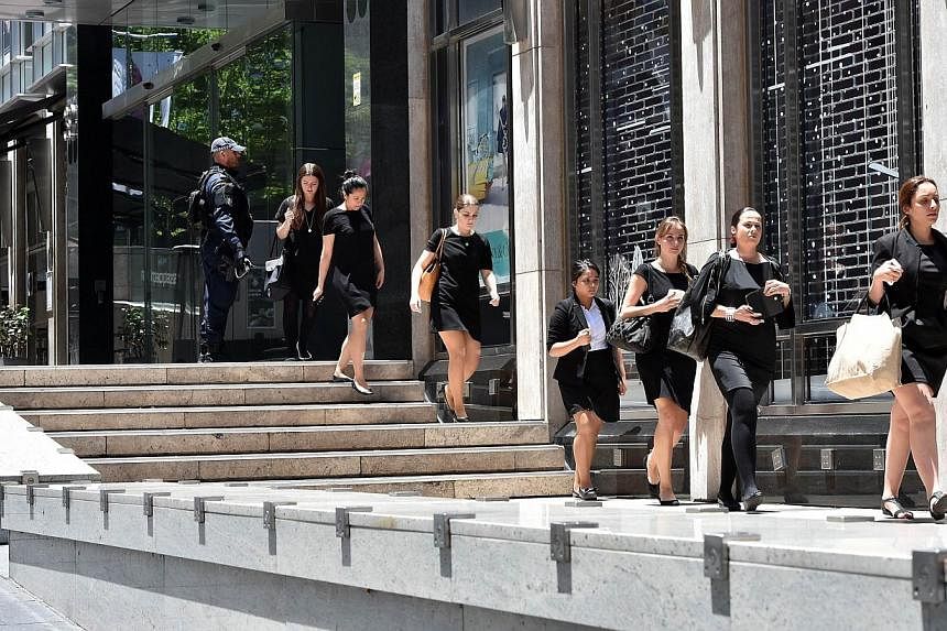 Commonwealth Bank of Australia, Westpac Banking Corp and Australia and New Zealand Banking Group said they had shut their Sydney CBD branches on Monday after a number of hostages were taken in a central city cafe. -- PHOTO: AFP