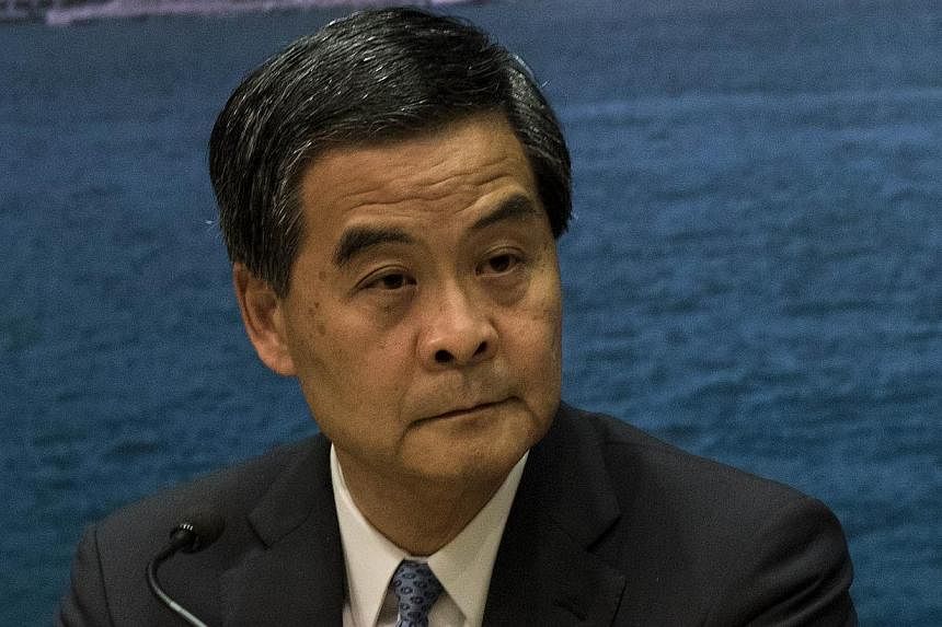 Hong Kong's leader Leung Chun Ying declared an end to more than 11 weeks of sit-in protests by pro-democracy demonstrators after police on Monday cleared the last remaining camp and arrested a handful of peaceful protesters. -- PHOTO: AFP&nbsp;