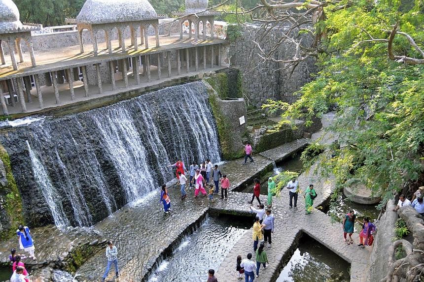 &nbsp;Indian visitors in the Rock Garden, built by self-taught Indian artist Nek Chand Saini over the course of 18 years, in Chandigarh. Deep inside his massive garden of handmade waterfalls and sculptures, he recalls toiling away secretly in the dea